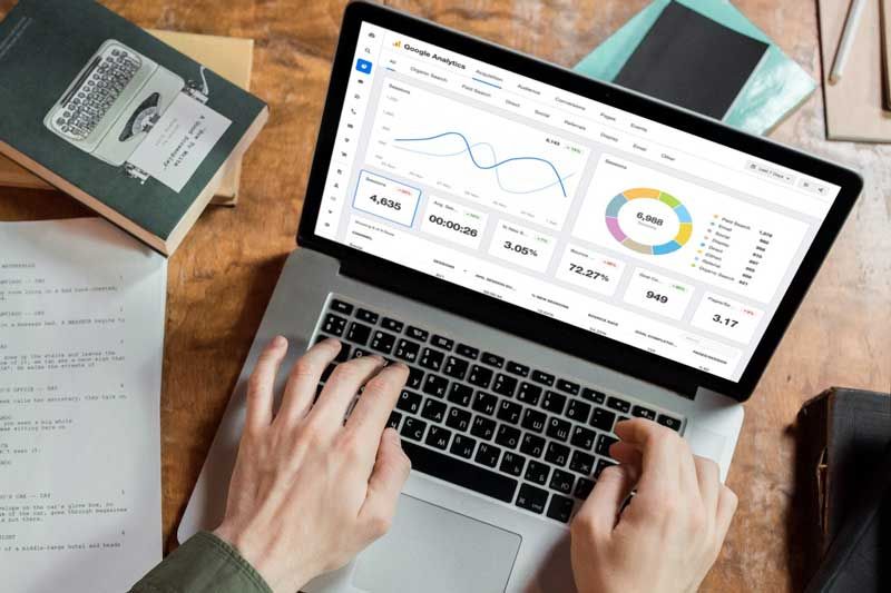 Computancy SEO Expert Analysing Local and National SEO Strategies on Computer Monitor Displaying Google Analytics Dashboard